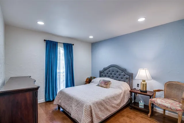 a bedroom with bed and window