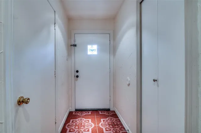 a view of hallway with closet