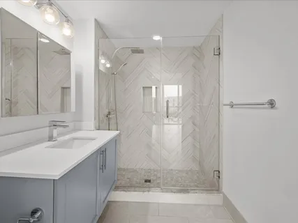 a view of a bedroom with washer and dryer