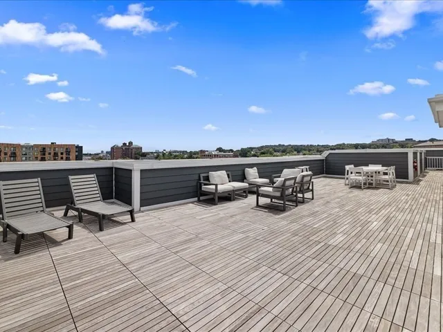 a view of a roof deck with patio