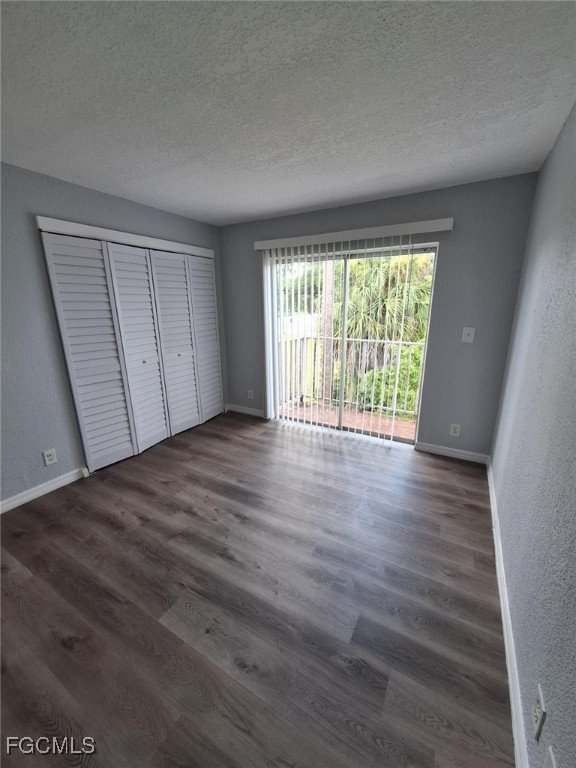 2575 Second Street Fort Myers, FL 33901 - Photo 3 of 8 a view of an empty room with wooden floor and a window