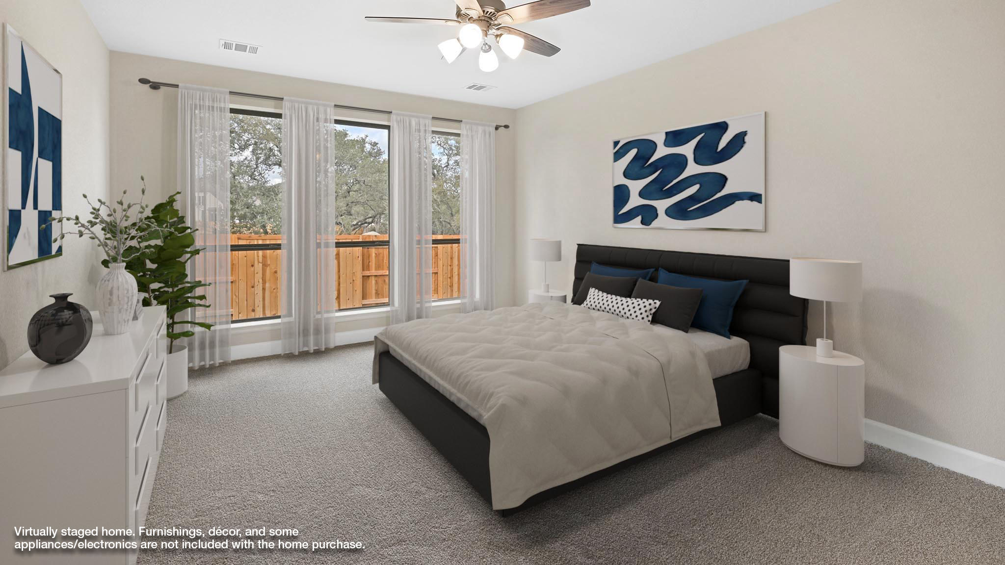 338 Prickly Poppy Loop Kyle, TX 78640 - Photo 6 of 40 Bedroom featuring light carpet and a ceiling fan