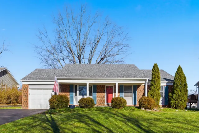 front view of a house with a yard
