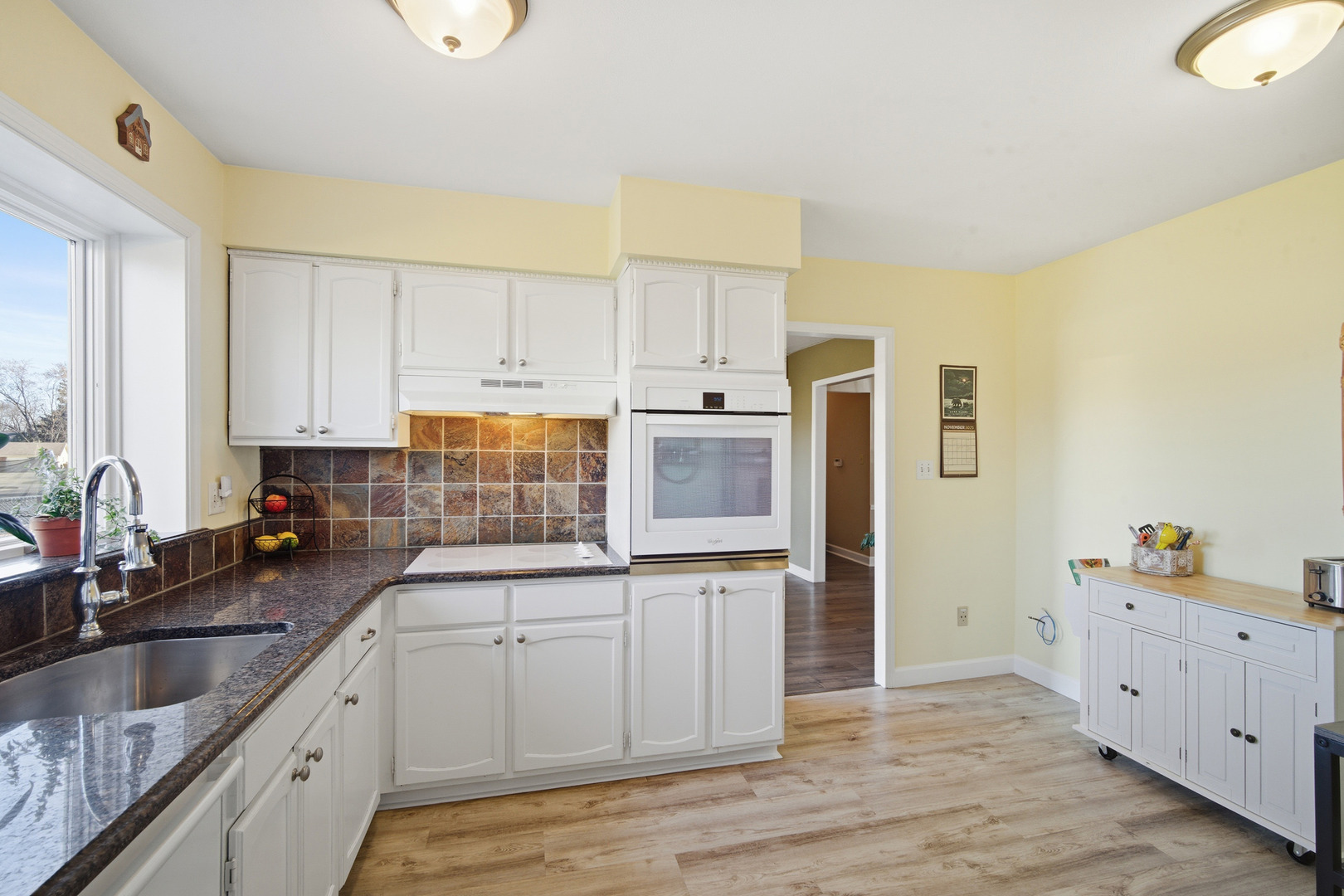 620 Twisted Oak Lane Buffalo Grove, IL 60089 - Photo 10 of 22 a kitchen with granite countertop a sink and cabinets