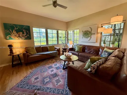 a living room with furniture and a rug