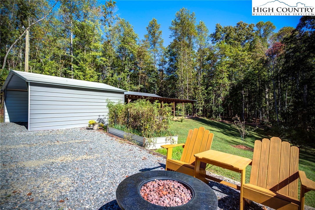 3460 South Center Church Road Thurmond, NC 28683 - Photo 45 of 50 a view of a swimming pool with a patio and a yard