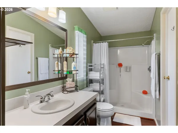 a en suite bathroom with a sink double vanity and a mirror