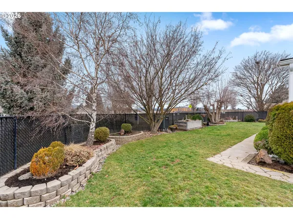 a backyard of a house with outdoor seating
