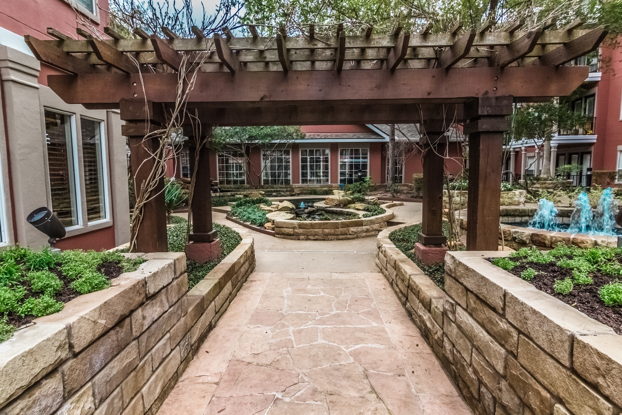 2400 McCue Road, Unit 262 Houston, TX 77056 - Photo 19 of 50 a front view of a house with a garden