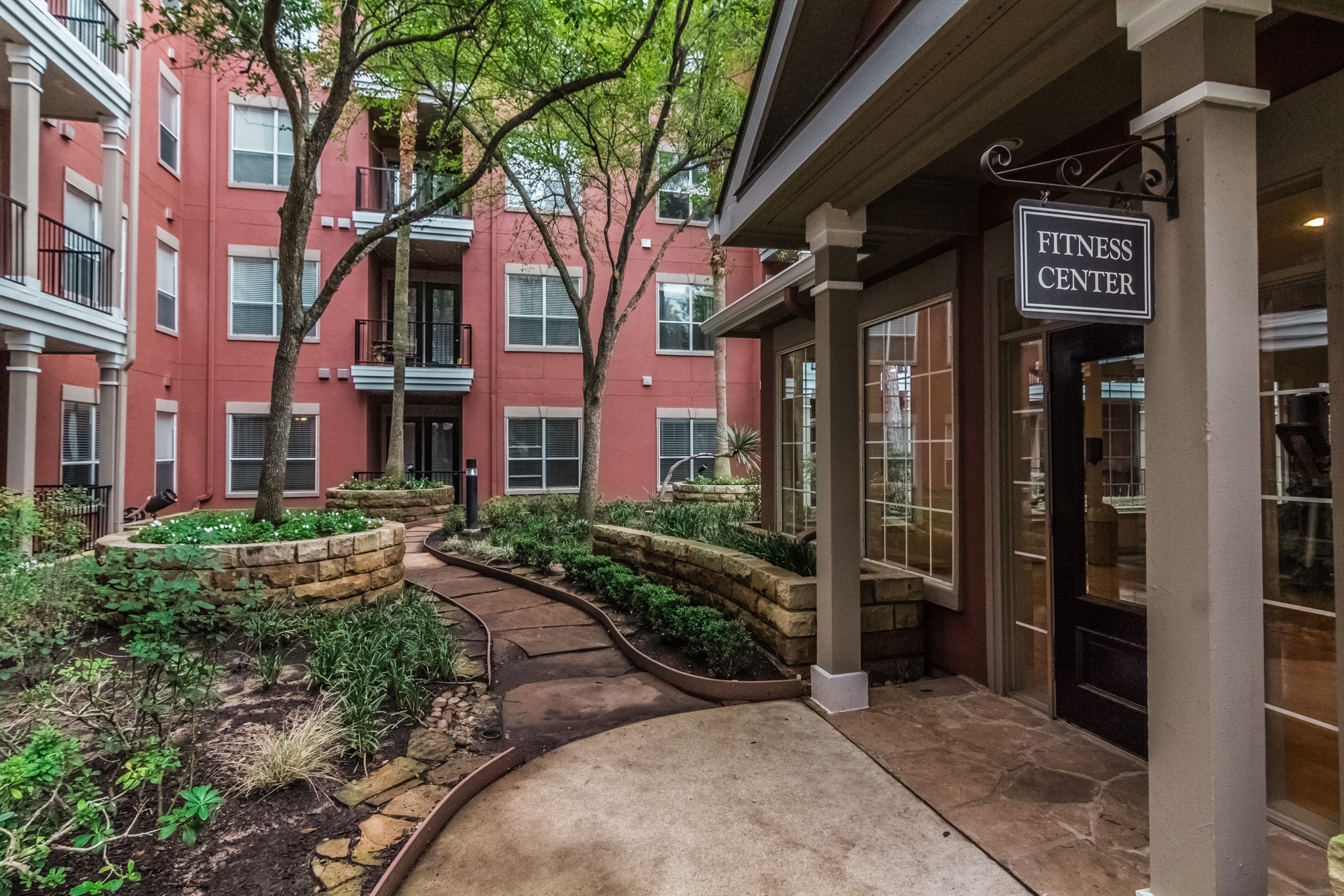2400 McCue Road, Unit 262 Houston, TX 77056 - Photo 23 of 50 a view of a building with a pathway