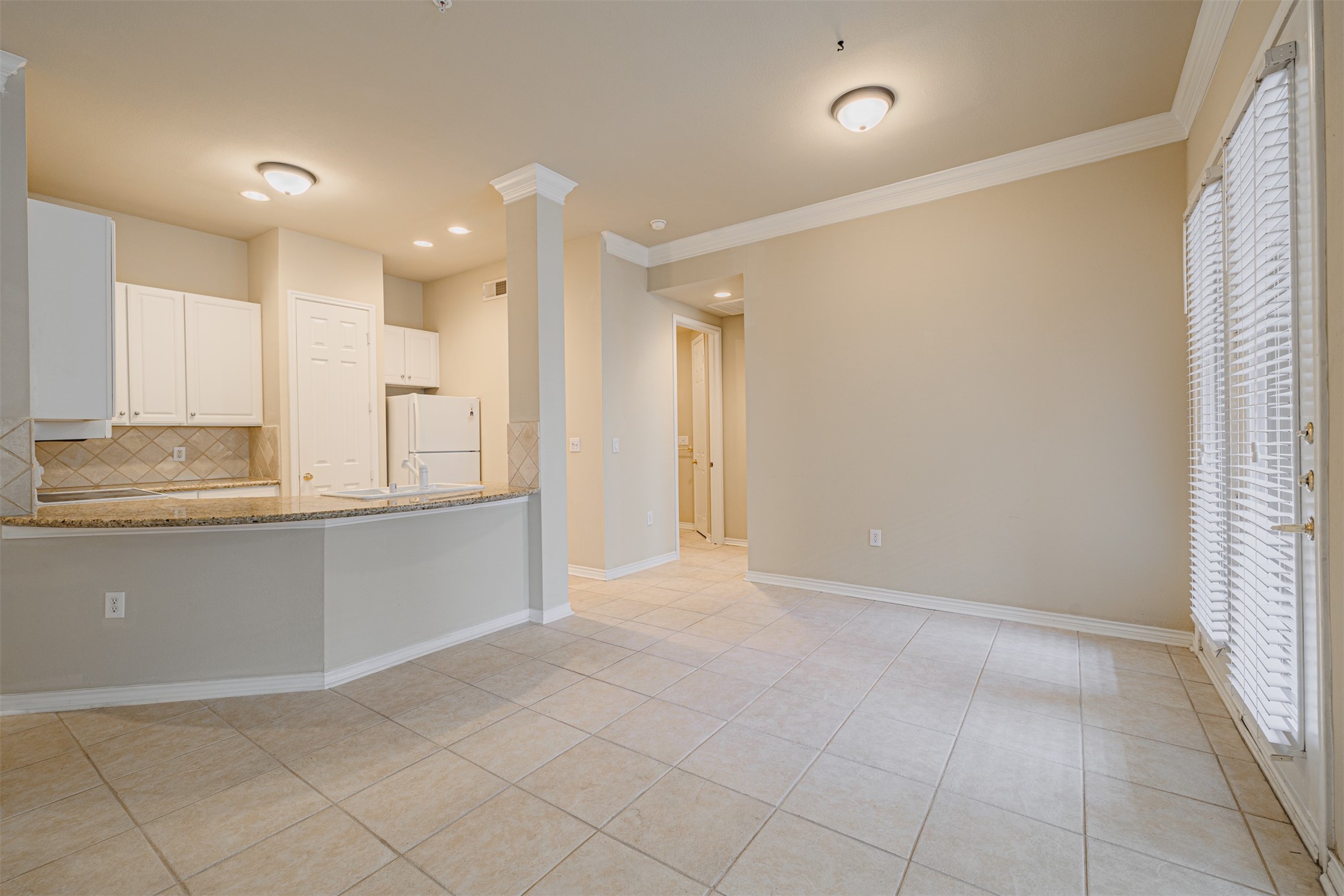 2400 McCue Road, Unit 262 Houston, TX 77056 - Photo 4 of 50 a view of kitchen with granite countertop cabinets and refrigerator