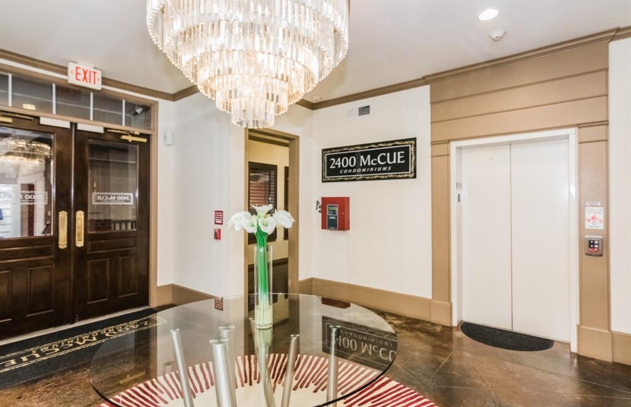 2400 McCue Road, Unit 262 Houston, TX 77056 - Photo 43 of 50 a view of an entryway with wooden floor