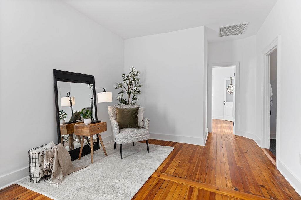115 South Jefferson Street Staunton, VA 24401 - Photo 17 of 29 a living room with furniture and a wooden floor