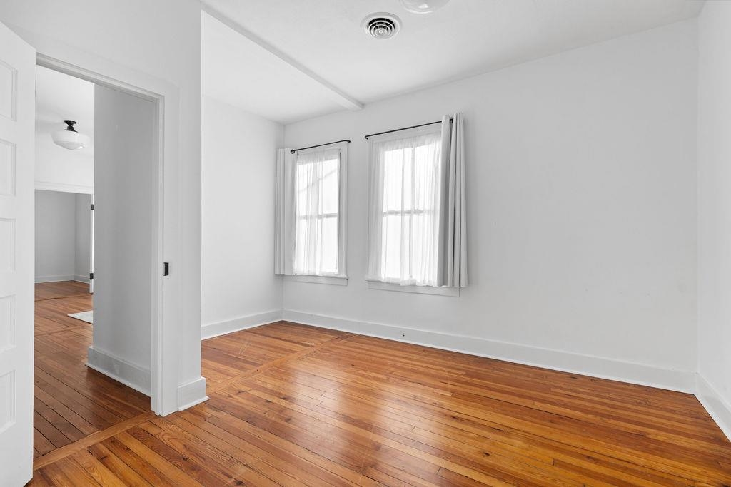 115 South Jefferson Street Staunton, VA 24401 - Photo 26 of 29 a view of an empty room with wooden floor and a window