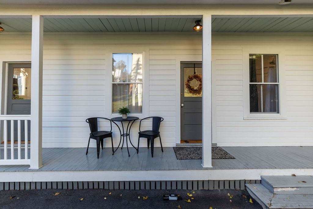 115 South Jefferson Street Staunton, VA 24401 - Photo 5 of 29 a view of a house with a porch and furniture