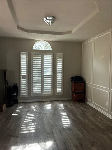 a view of staircase with railing and white walls