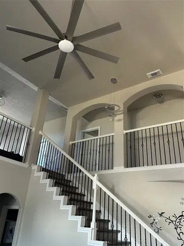 a kitchen with stainless steel appliances granite countertop a refrigerator a stove a sink and a refrigerator