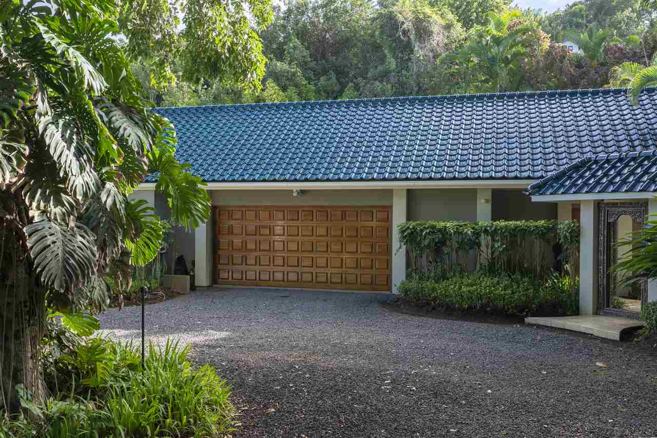 668 Huelo Road Haiku, HI 96708 - Photo 18 of 28 a front view of a house with a garden