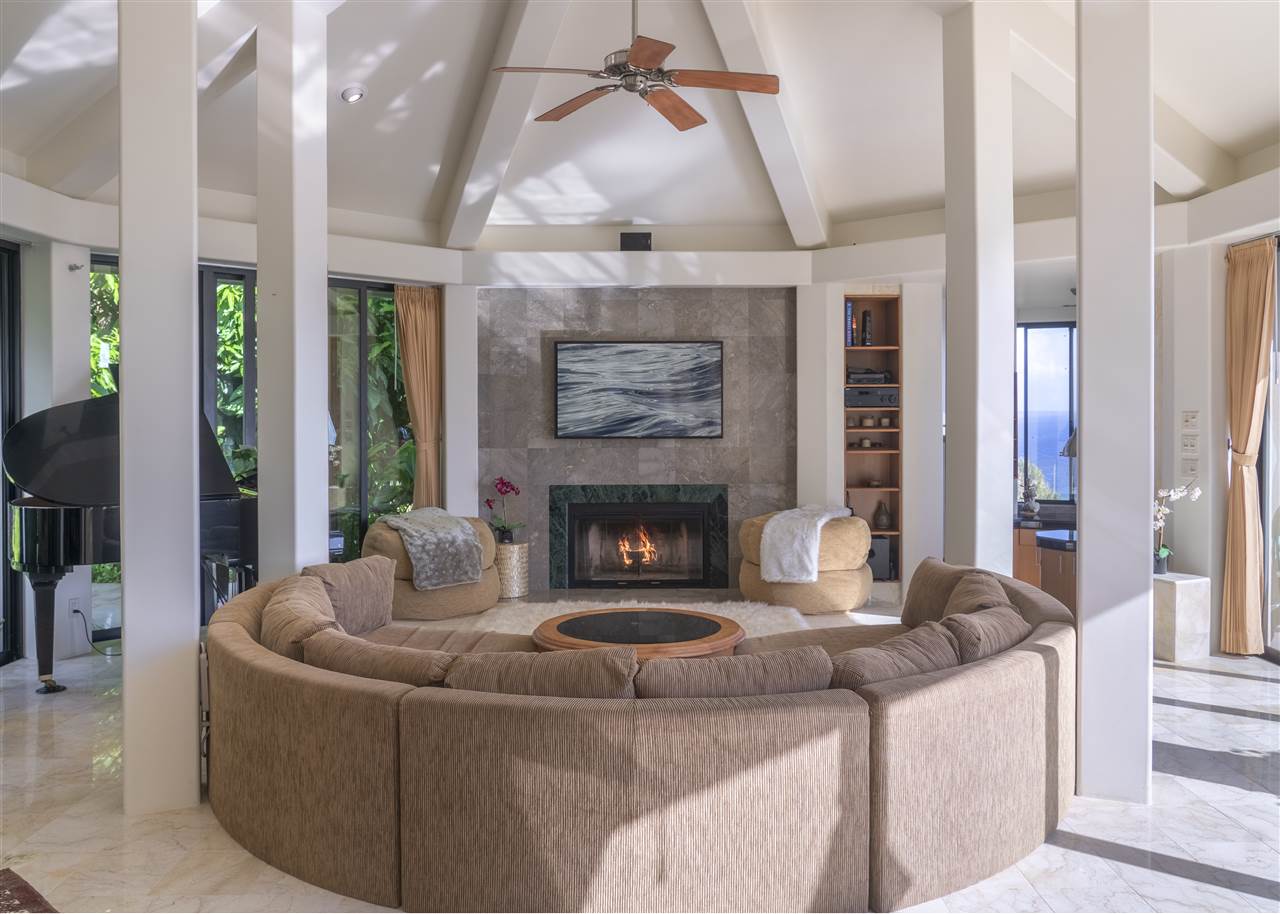 668 Huelo Road Haiku, HI 96708 - Photo 5 of 28 a living room with furniture and a fireplace