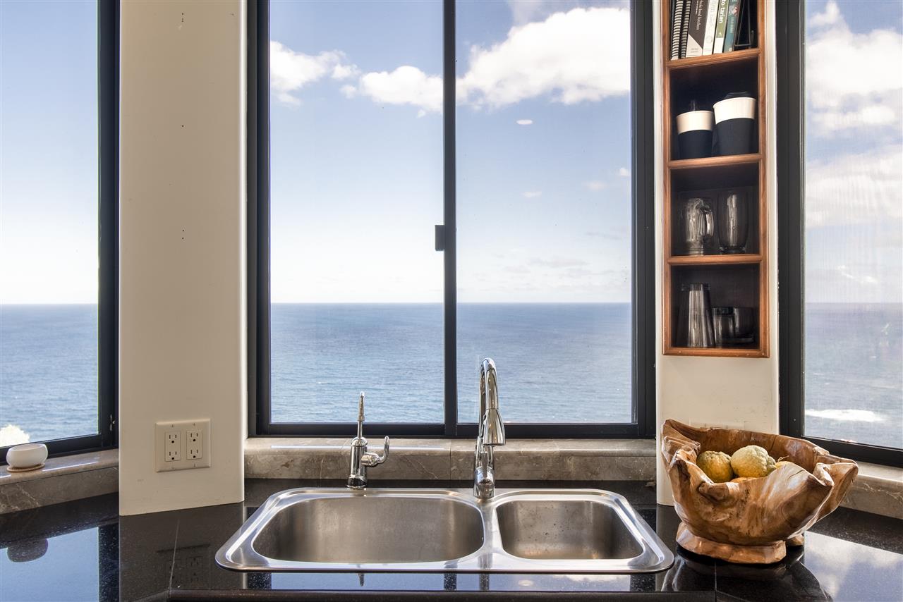 668 Huelo Road Haiku, HI 96708 - Photo 10 of 28 a kitchen with a sink and a window