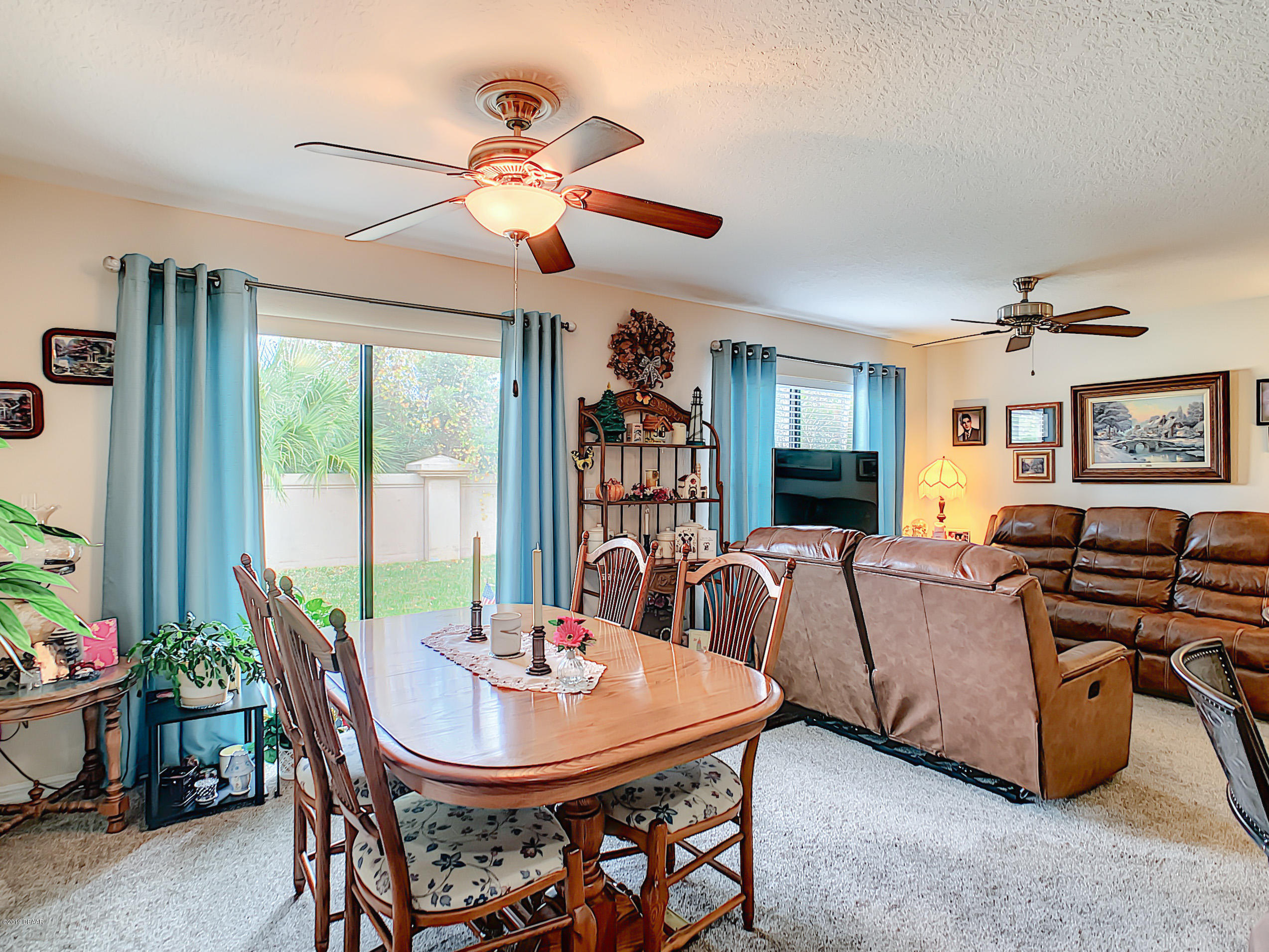 180 Tarracina Way Daytona Beach, FL 32117 - Photo 11 of 39 a view of a dining room with furniture window and outside view