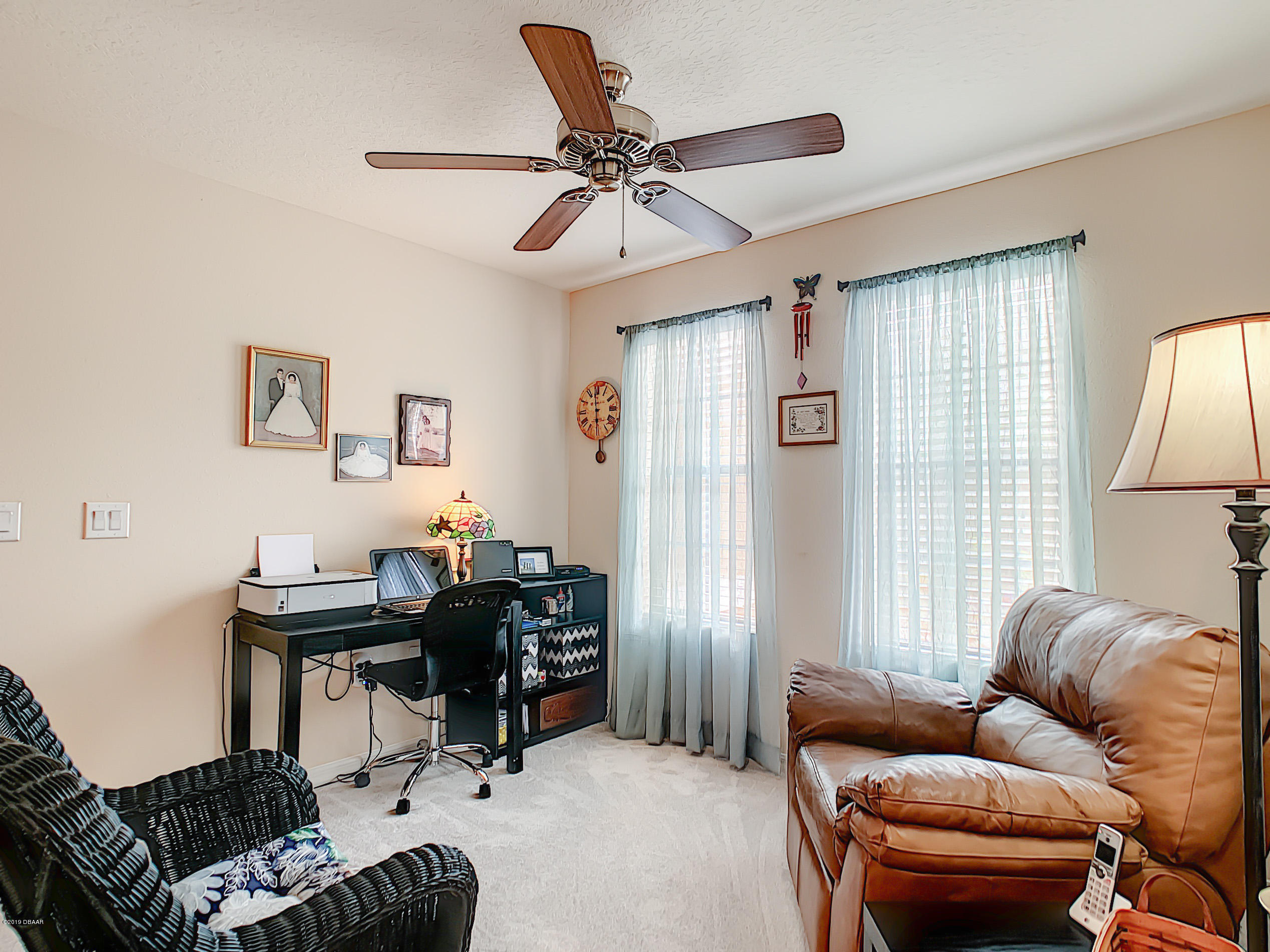 180 Tarracina Way Daytona Beach, FL 32117 - Photo 17 of 39 a work room with furniture and a window