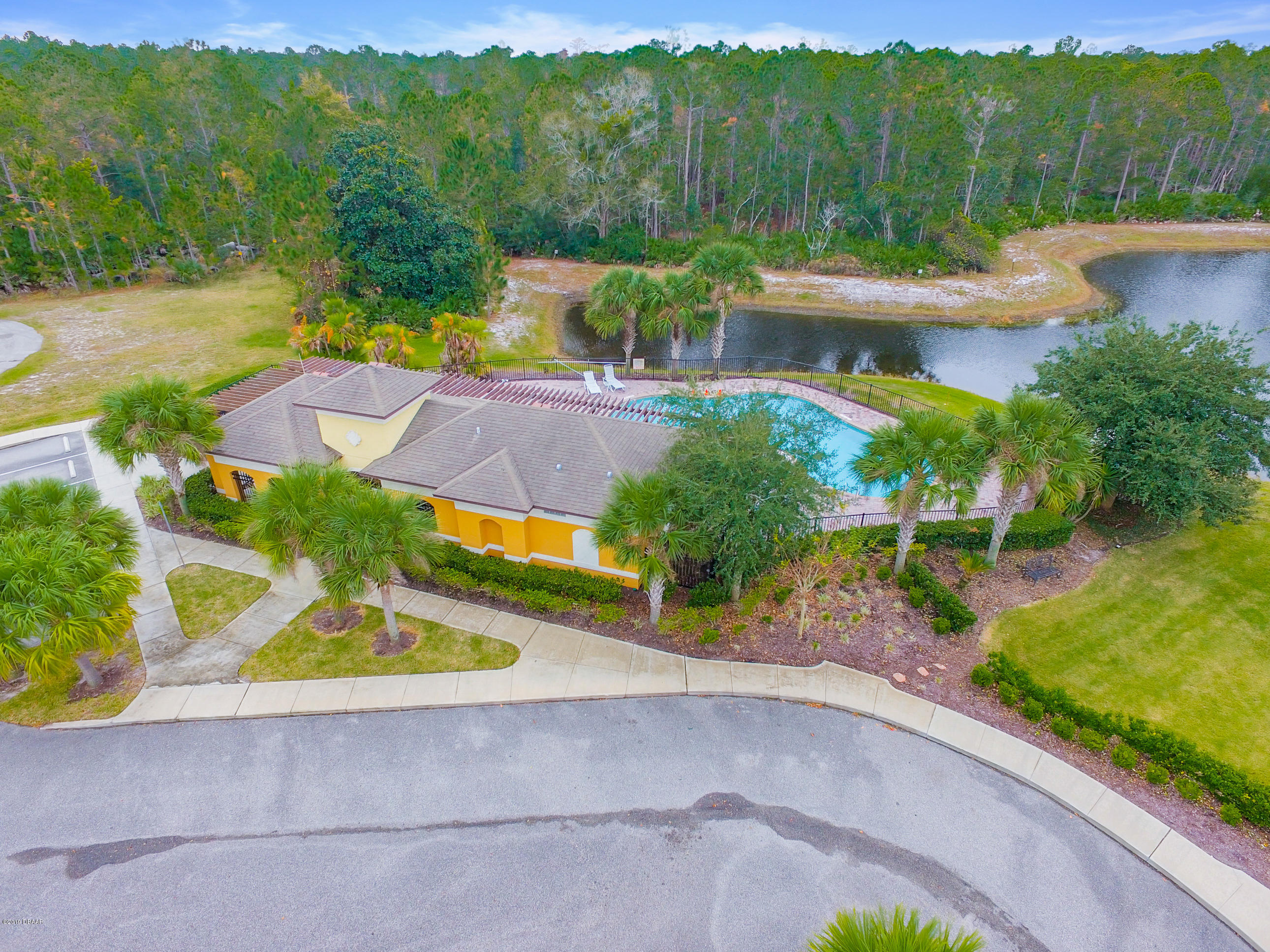 180 Tarracina Way Daytona Beach, FL 32117 - Photo 25 of 39 a view of a lake with houses