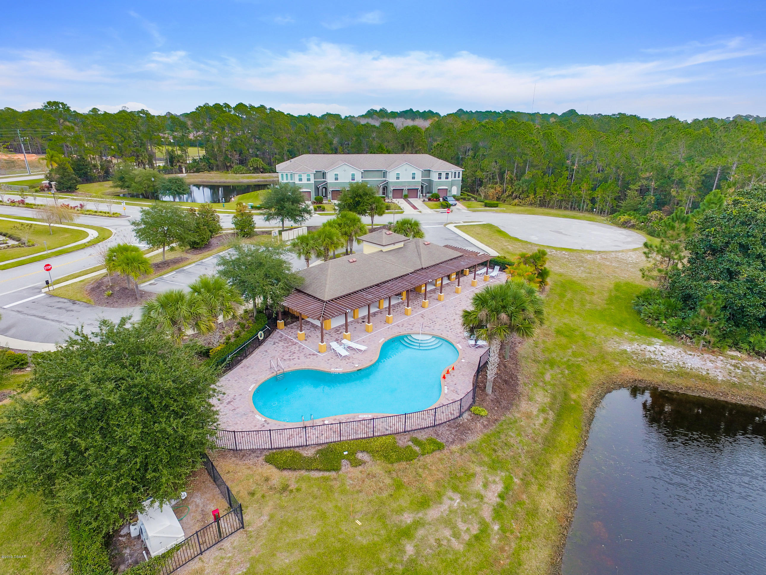 180 Tarracina Way Daytona Beach, FL 32117 - Photo 26 of 39 a view of a lake with a yard and lake view