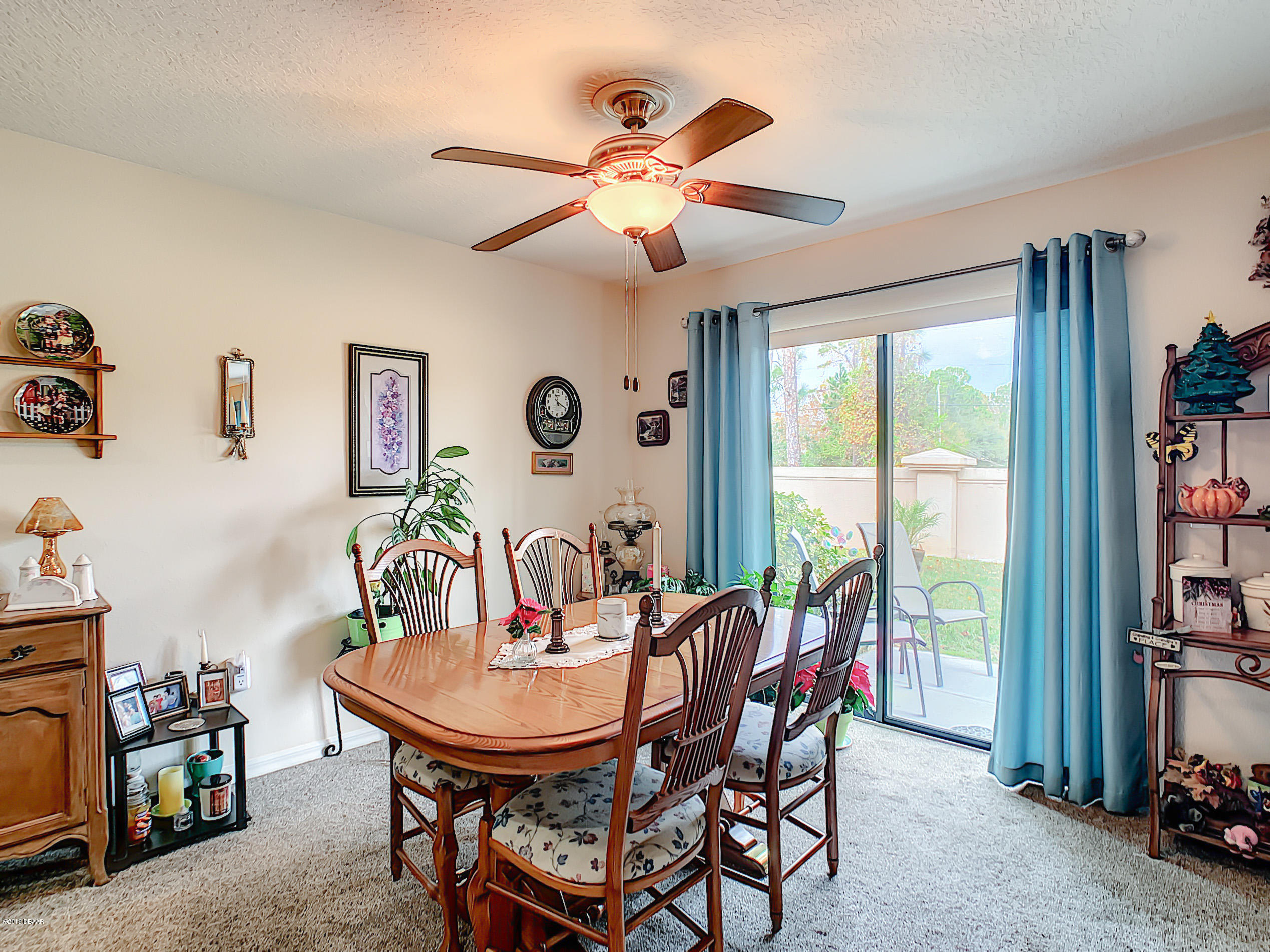 180 Tarracina Way Daytona Beach, FL 32117 - Photo 6 of 39 a view of a dining room with furniture window and outside view