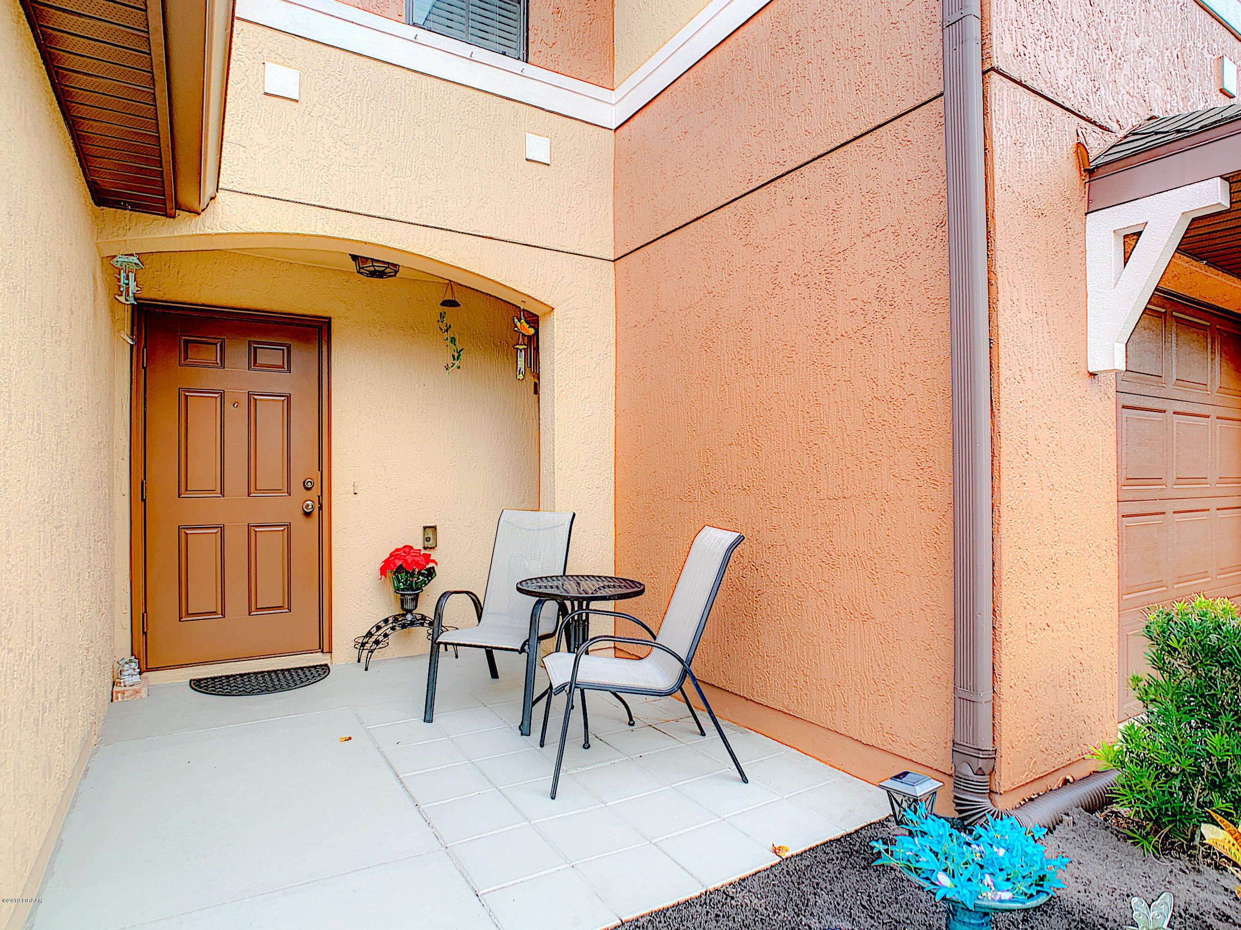 180 Tarracina Way Daytona Beach, FL 32117 - Photo 8 of 39 a view of two chairs in a balcony