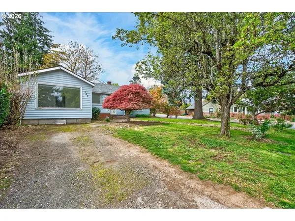 a view of house with yard