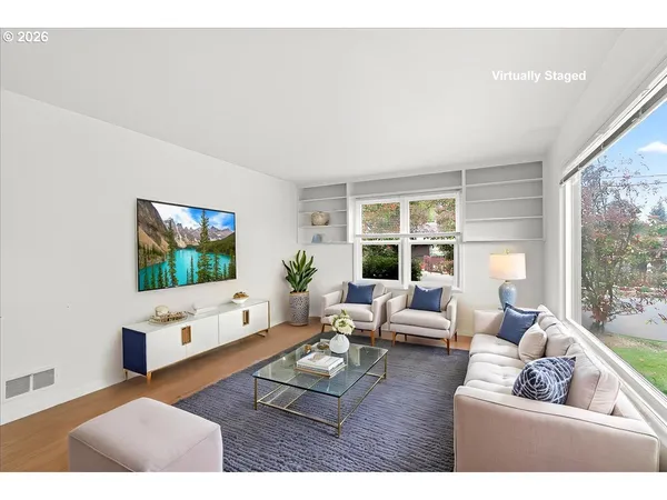 a living room with furniture a flat screen tv and a large window