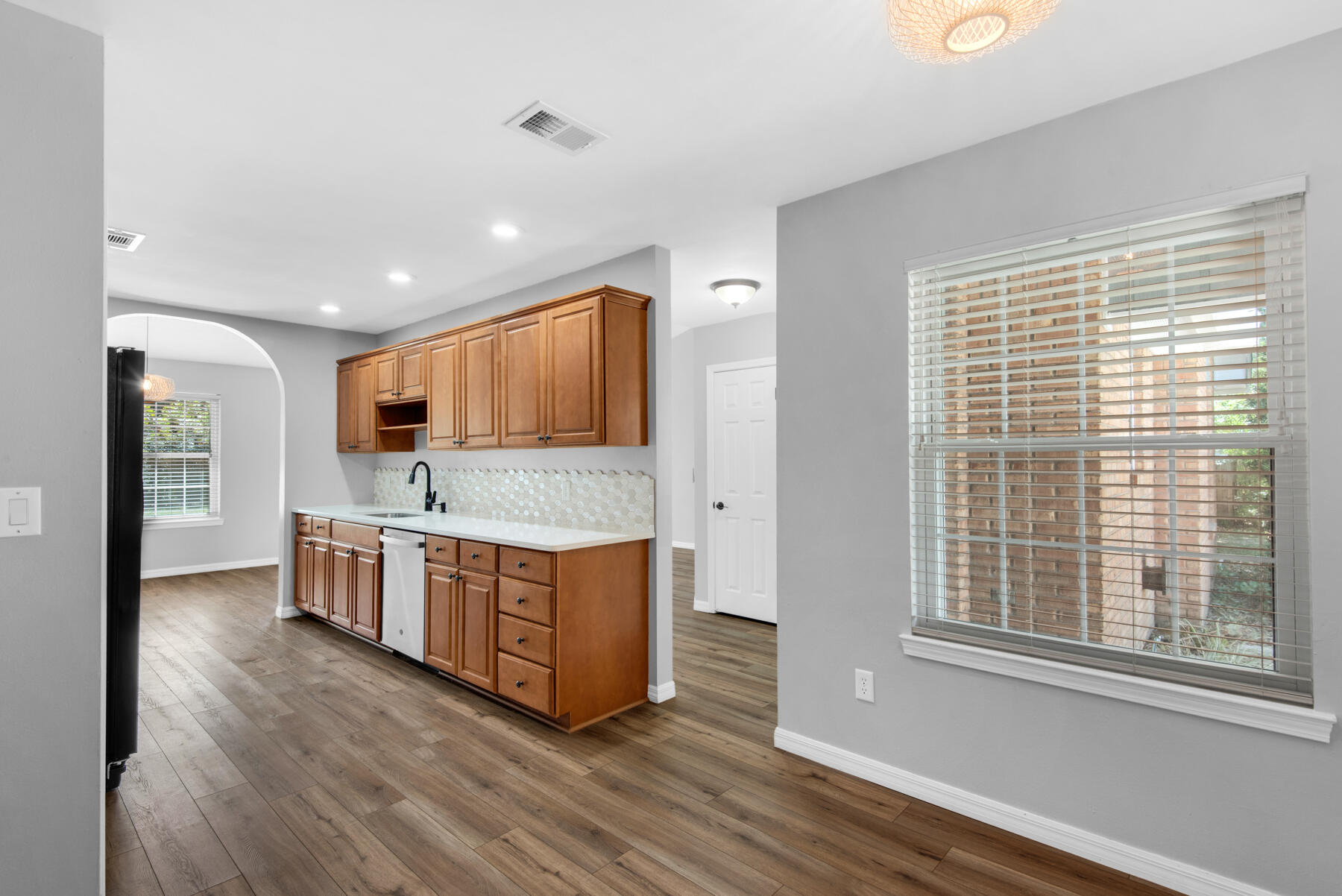 4022 13th Street Niceville, FL 32578 - Photo 14 of 37 a kitchen with stainless steel appliances granite countertop a stove and a sink