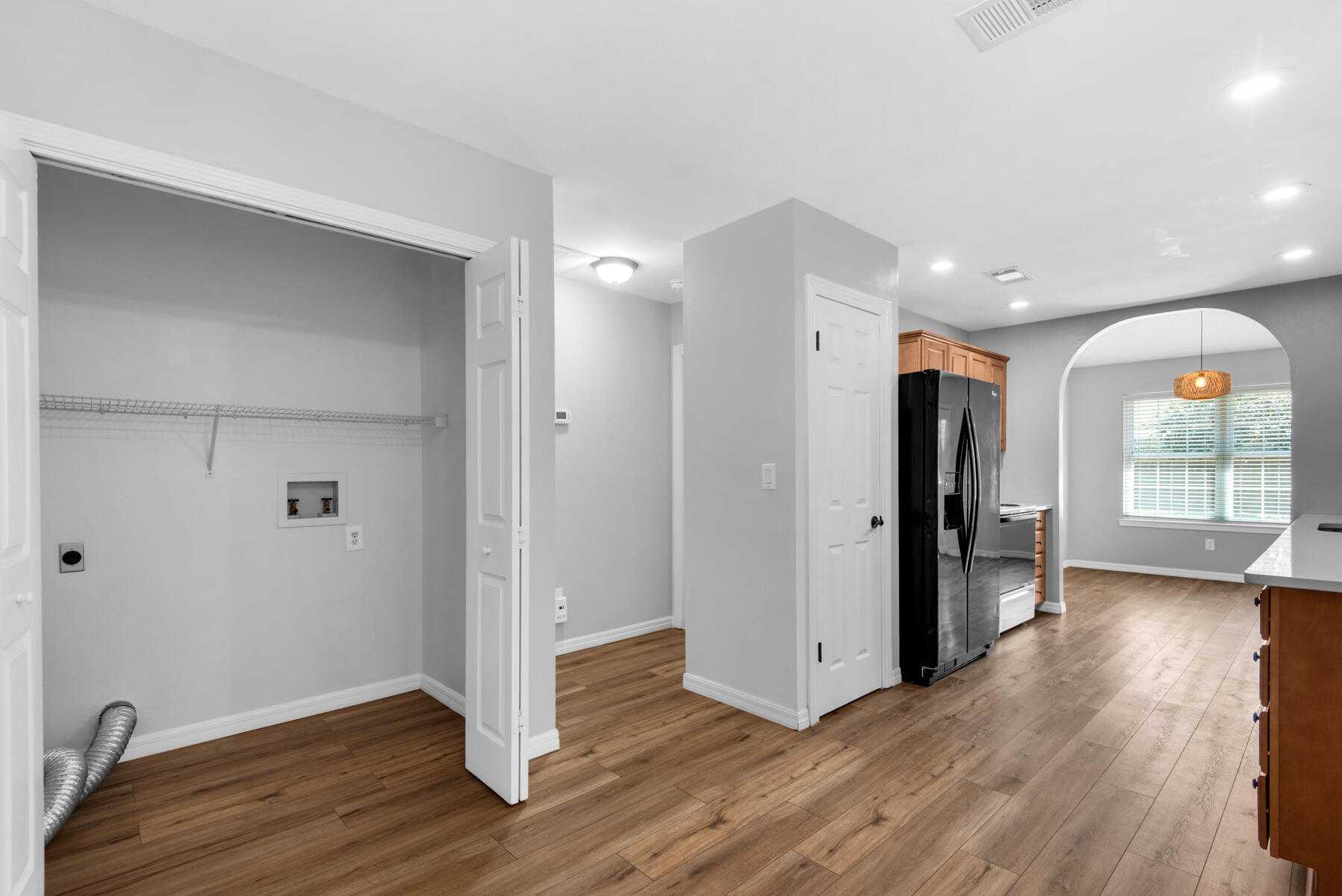 4022 13th Street Niceville, FL 32578 - Photo 16 of 37 a view of a hallway with wooden floor and closet