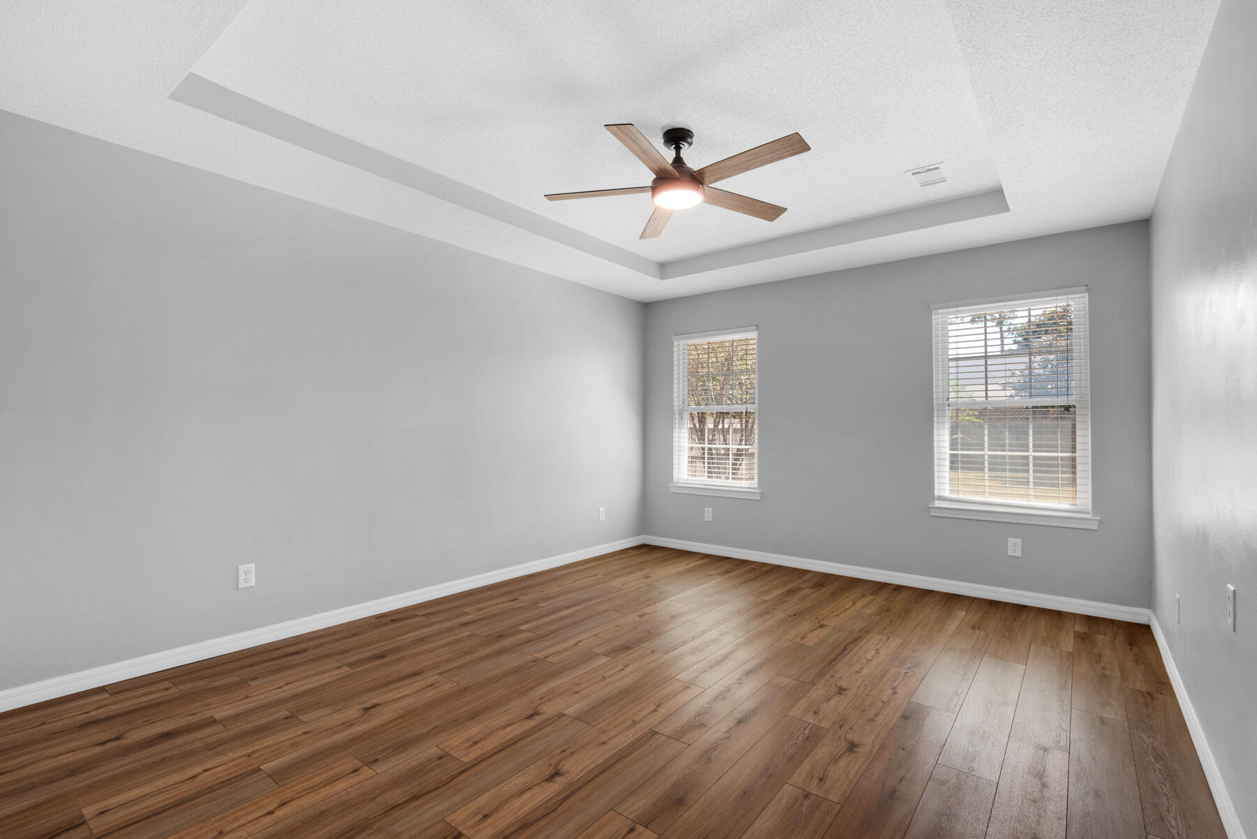 4022 13th Street Niceville, FL 32578 - Photo 18 of 37 a view of an empty room with wooden floor and a window