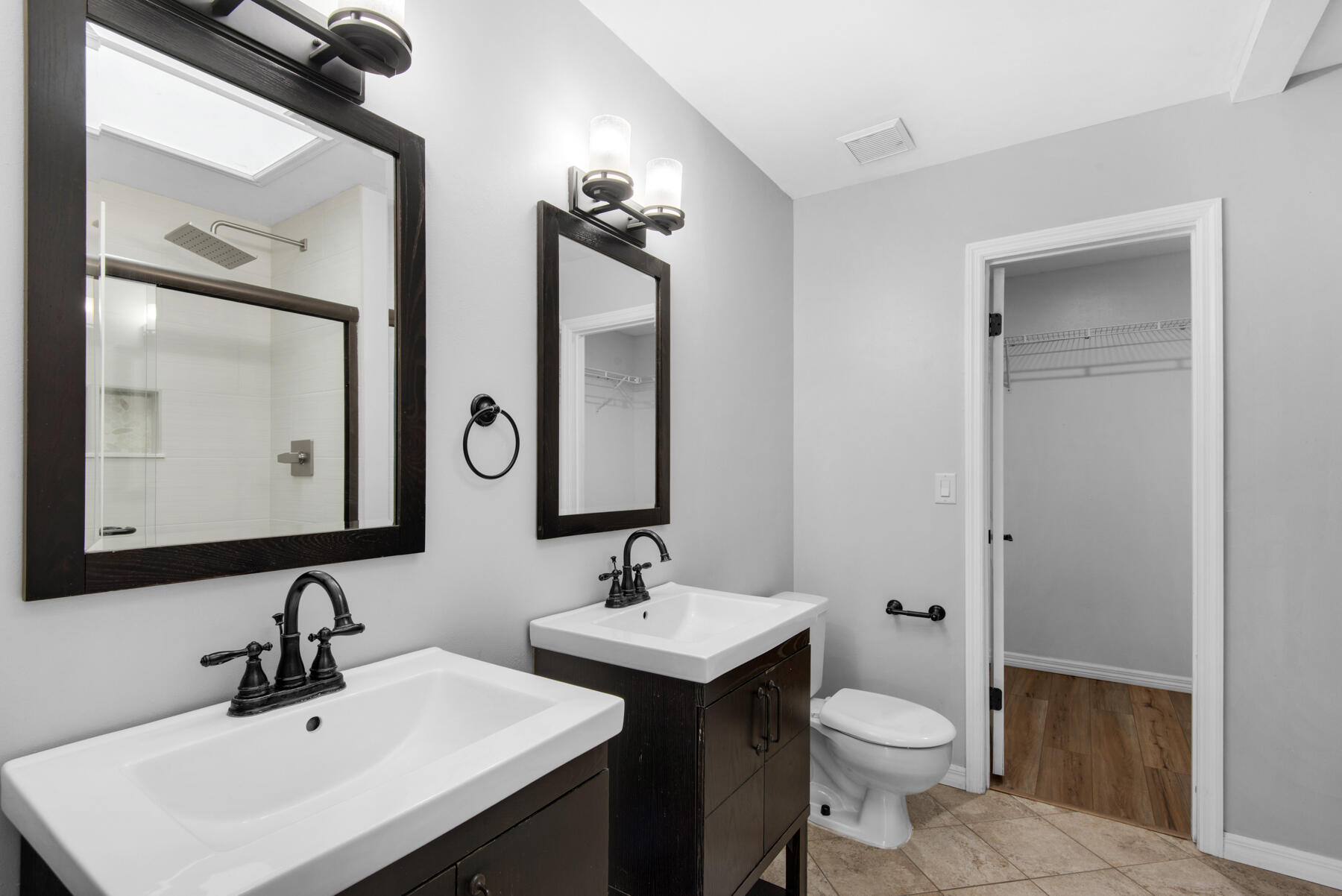 4022 13th Street Niceville, FL 32578 - Photo 19 of 37 a bathroom with a toilet sink and mirror
