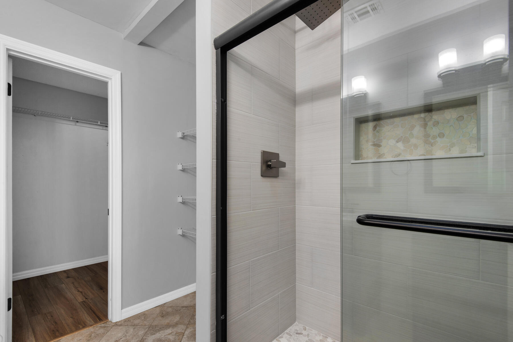 4022 13th Street Niceville, FL 32578 - Photo 21 of 37 a bathroom with a shower and a glass door