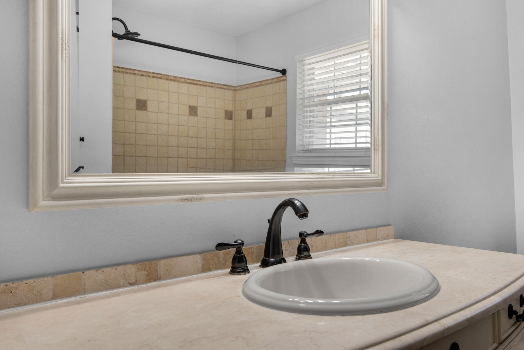 4022 13th Street Niceville, FL 32578 - Photo 27 of 37 a bathroom with a sink and a bathtub