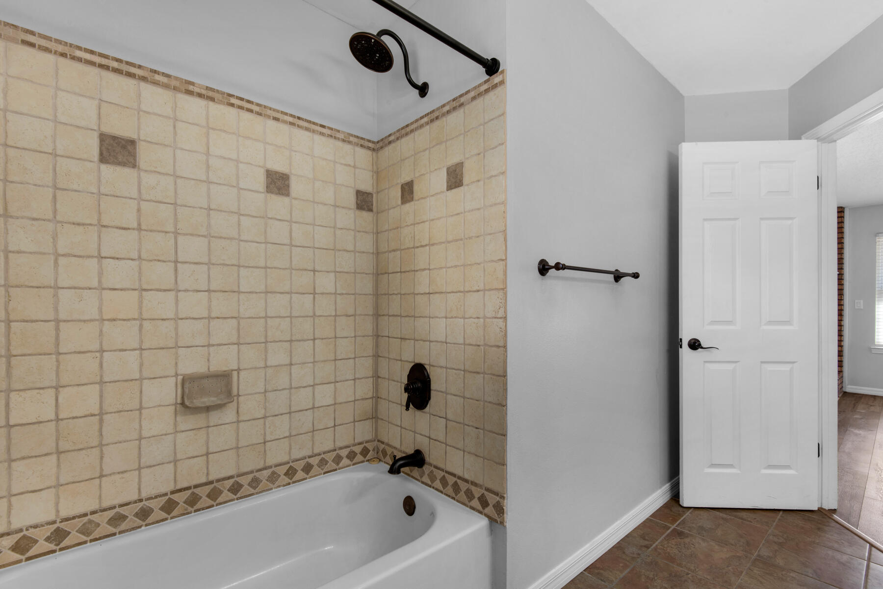 4022 13th Street Niceville, FL 32578 - Photo 28 of 37 a bathroom with a bathtub and shower