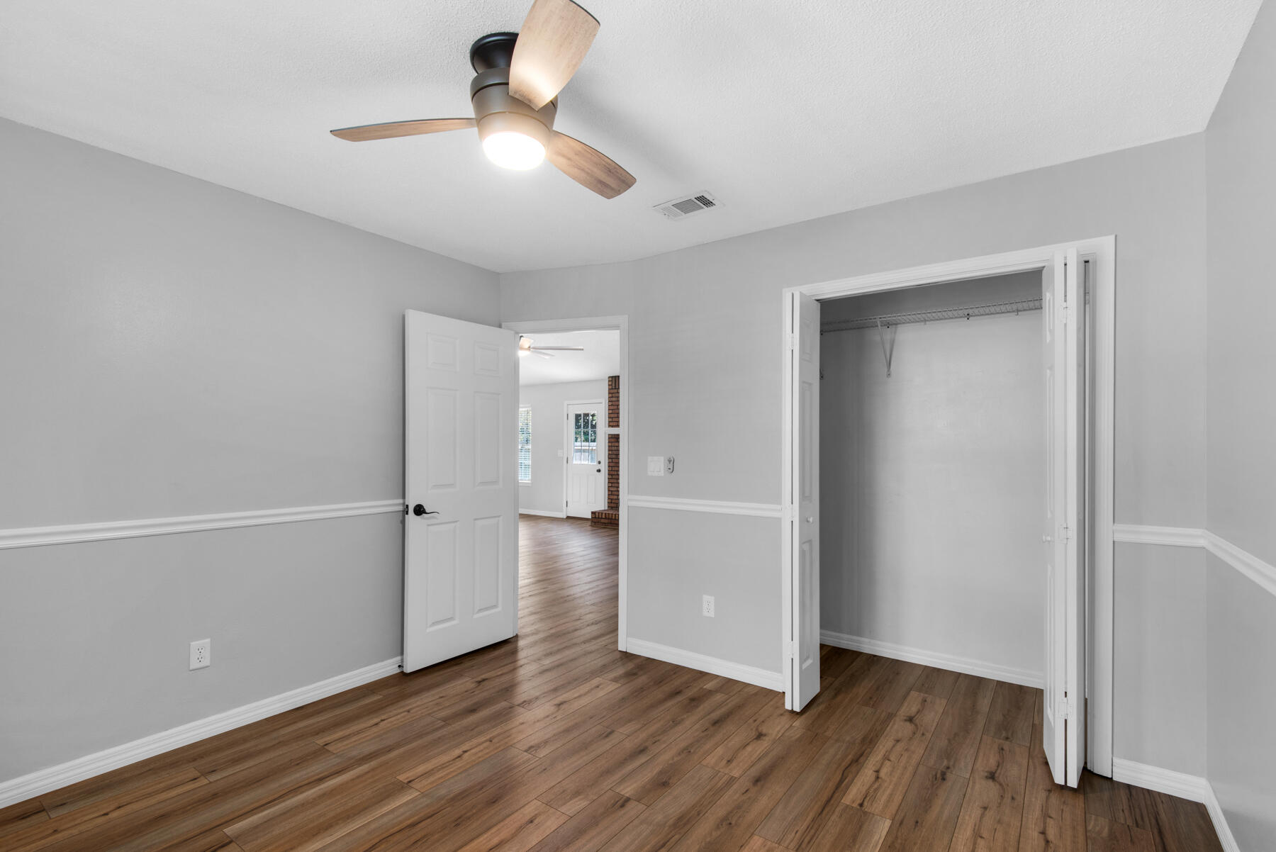 4022 13th Street Niceville, FL 32578 - Photo 29 of 37 a view of an empty room and wooden floor