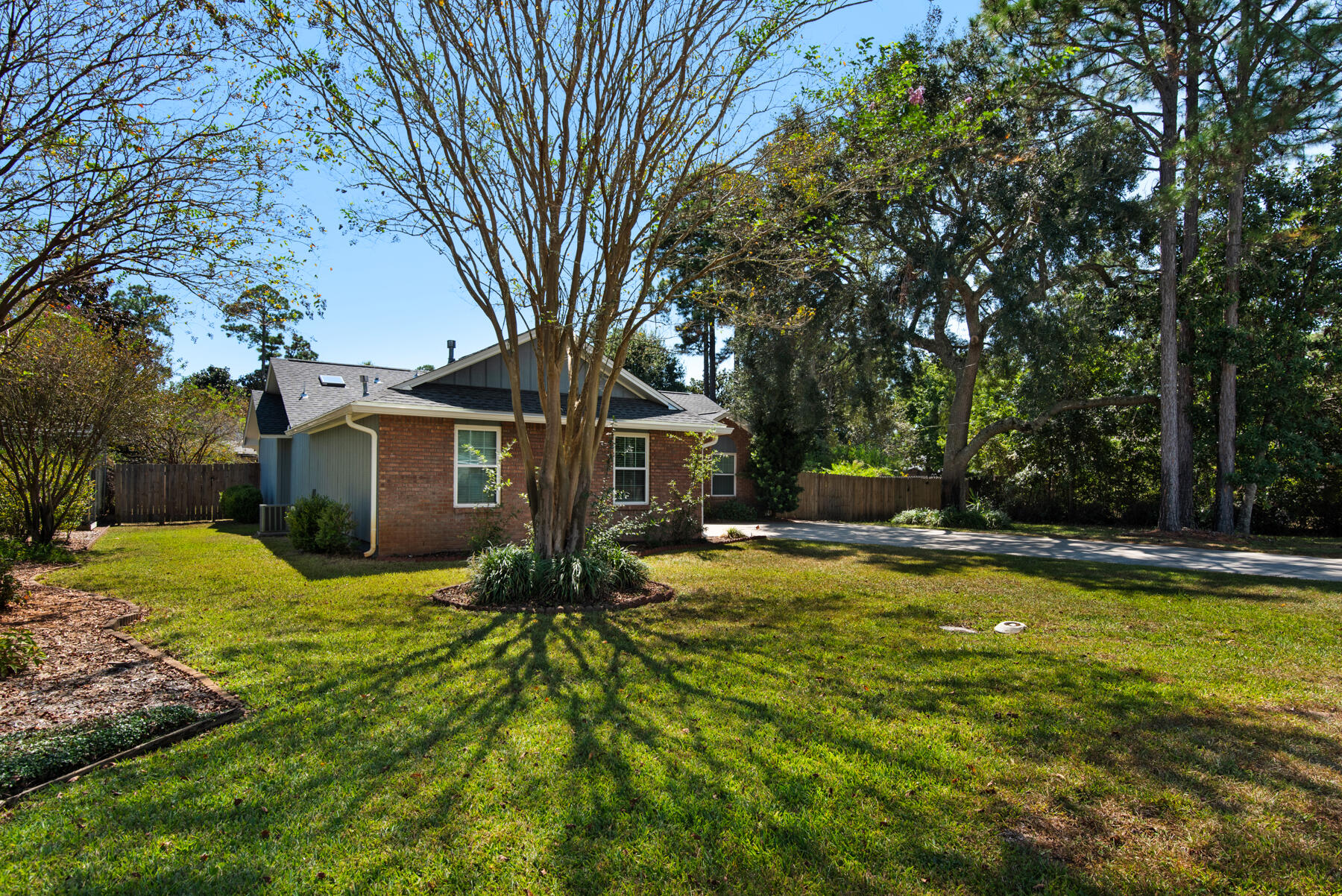 4022 13th Street Niceville, FL 32578 - Photo 3 of 37 a view of a house with pool and trees
