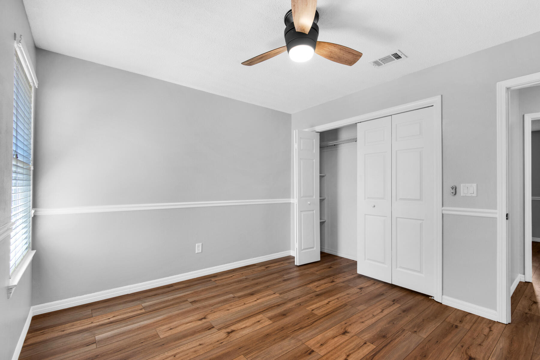 4022 13th Street Niceville, FL 32578 - Photo 31 of 37 wooden floor in an empty room