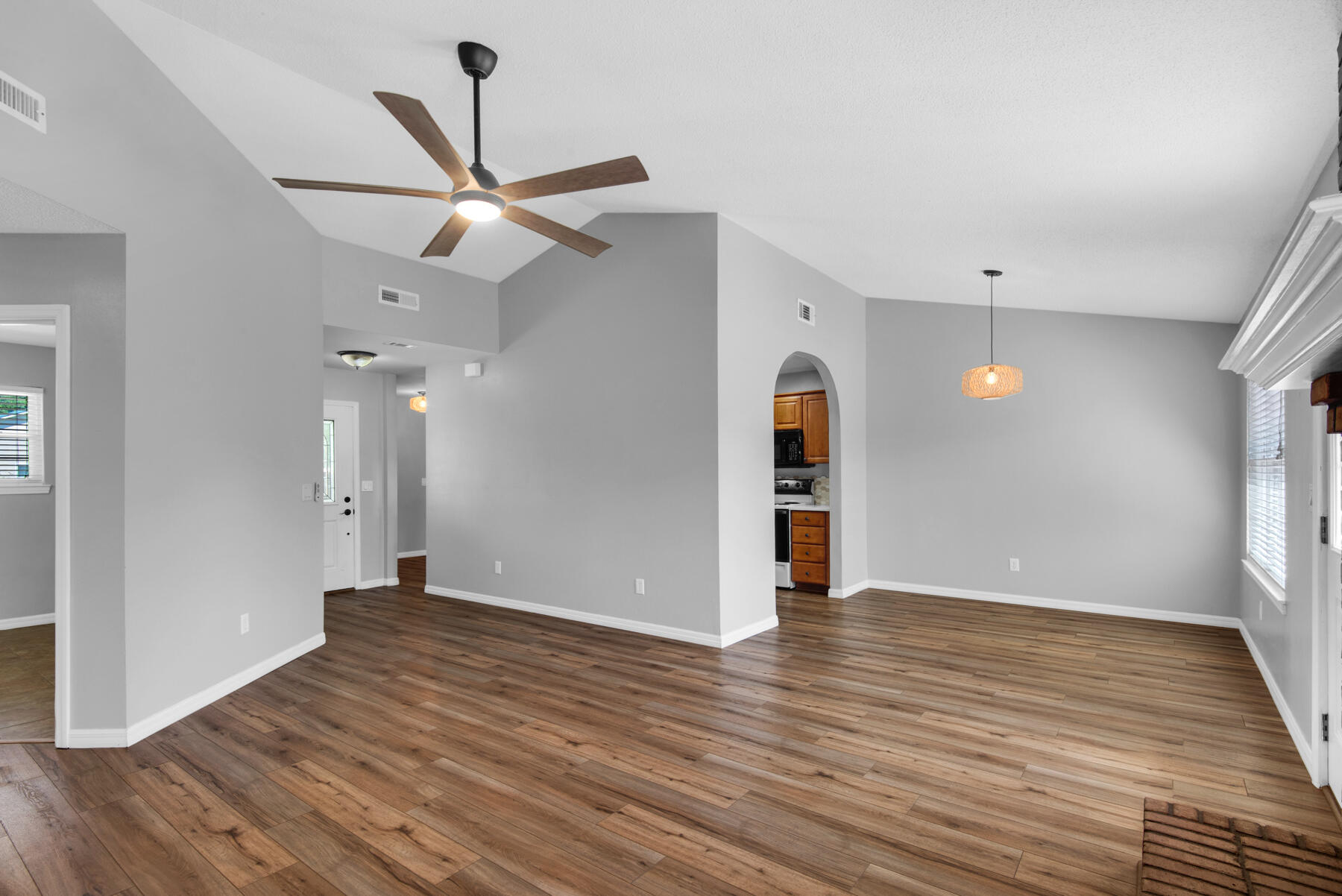 4022 13th Street Niceville, FL 32578 - Photo 10 of 37 a view of an empty room with wooden floor