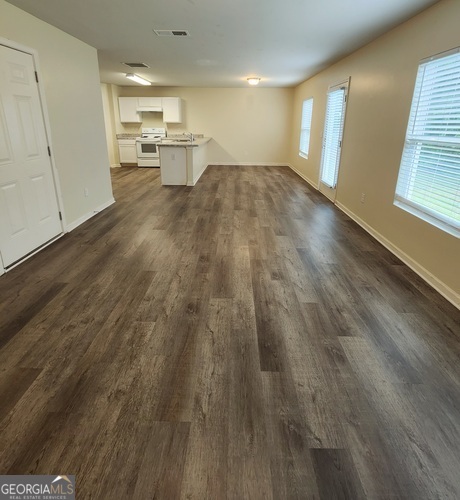 335 Freeman Circle Villa Rica, GA 30180 - Photo 5 of 12 a view of empty room with wooden floor and window