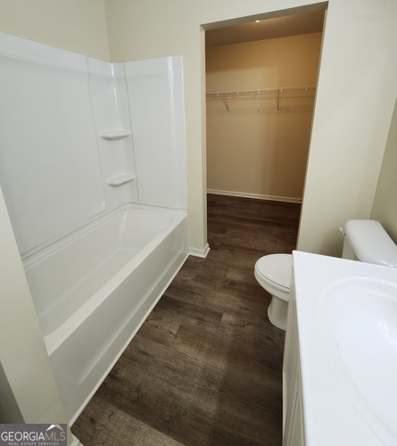 335 Freeman Circle Villa Rica, GA 30180 - Photo 6 of 12 a bathroom with a bathtub and toilet