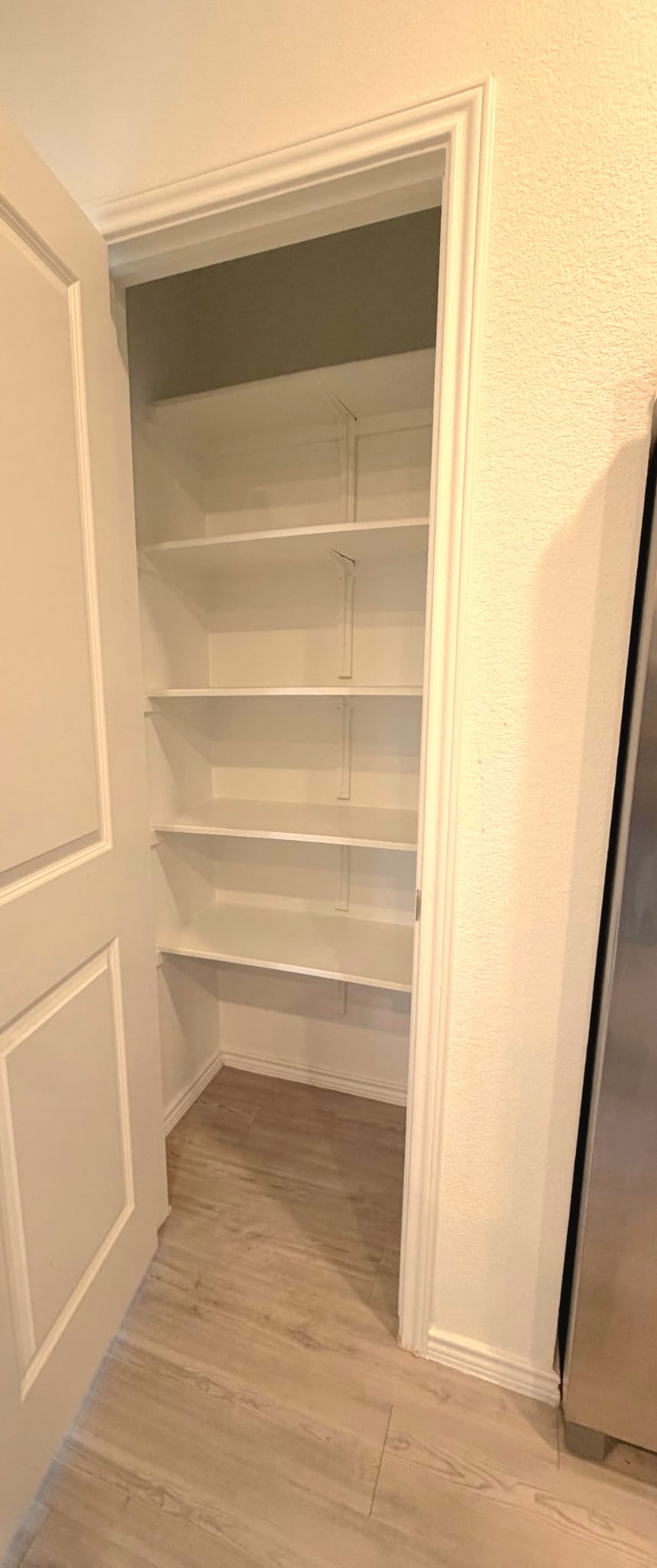 2520 Four Waters Loop Georgetown, TX 78628 - Photo 14 of 15 a view of walk in closet with empty racks