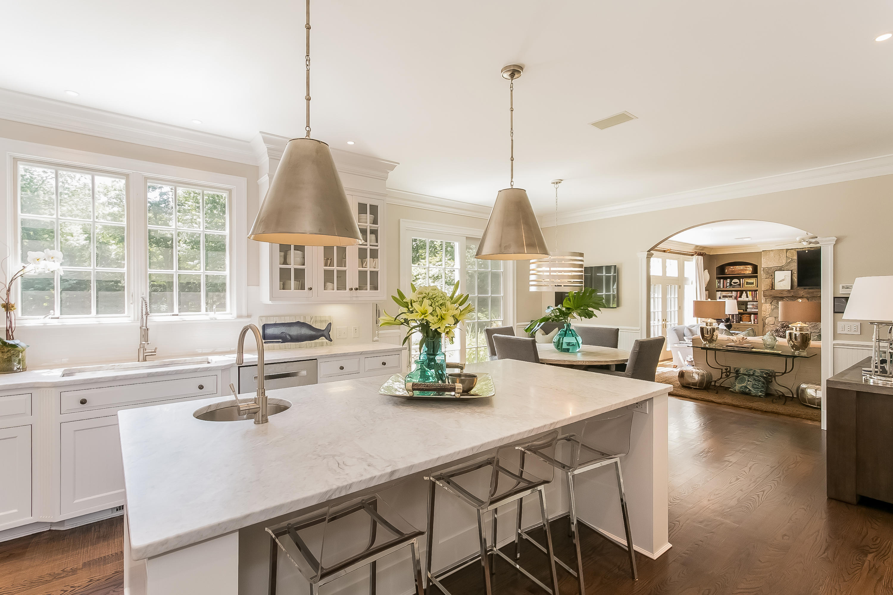 50 Deepwood Road Darien, CT 06820 - Photo 15 of 54 a view of a dining room and livingroom with furniture wooden floor a chandelier
