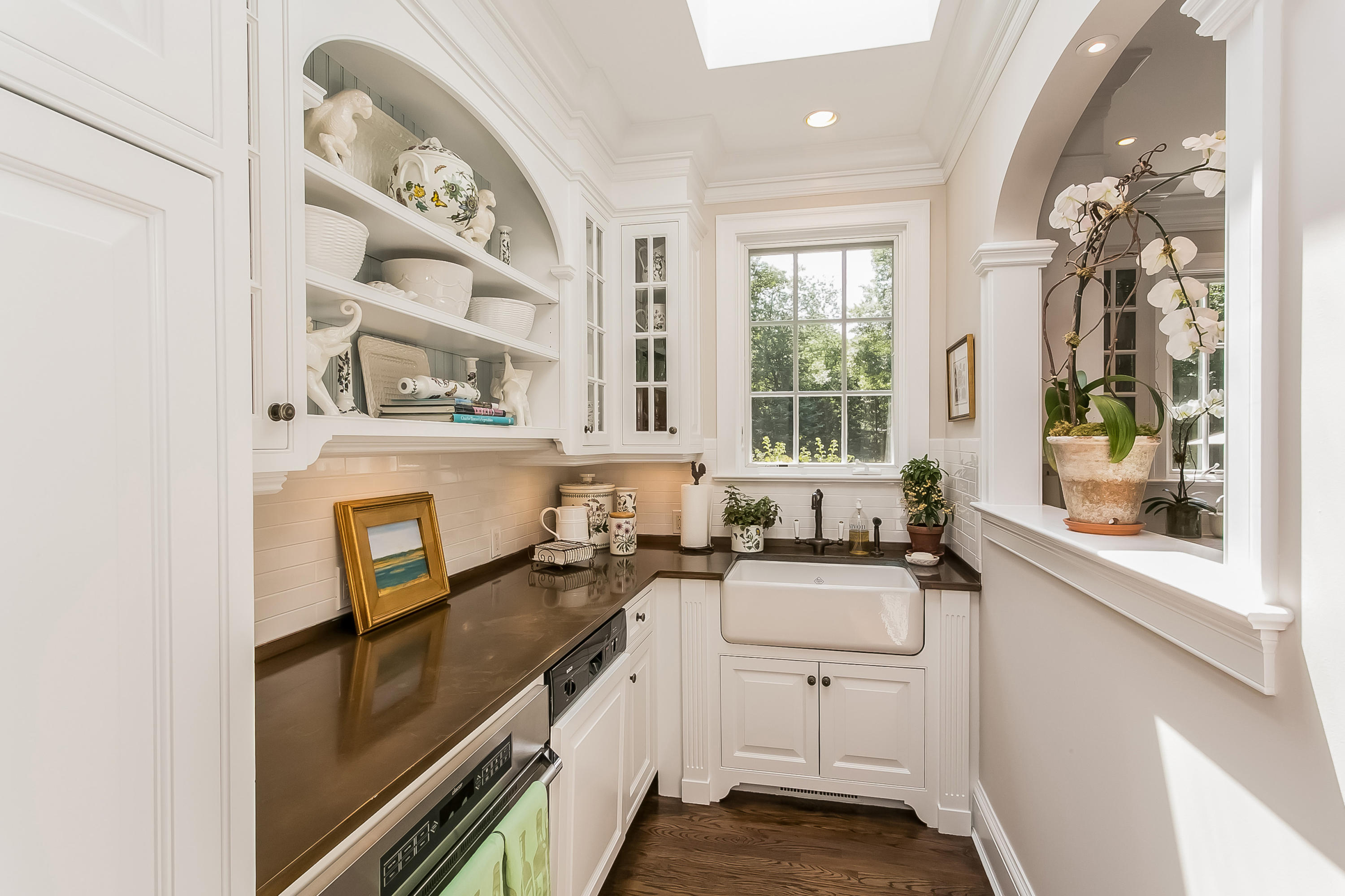 50 Deepwood Road Darien, CT 06820 - Photo 20 of 54 a kitchen with sink cabinets and window