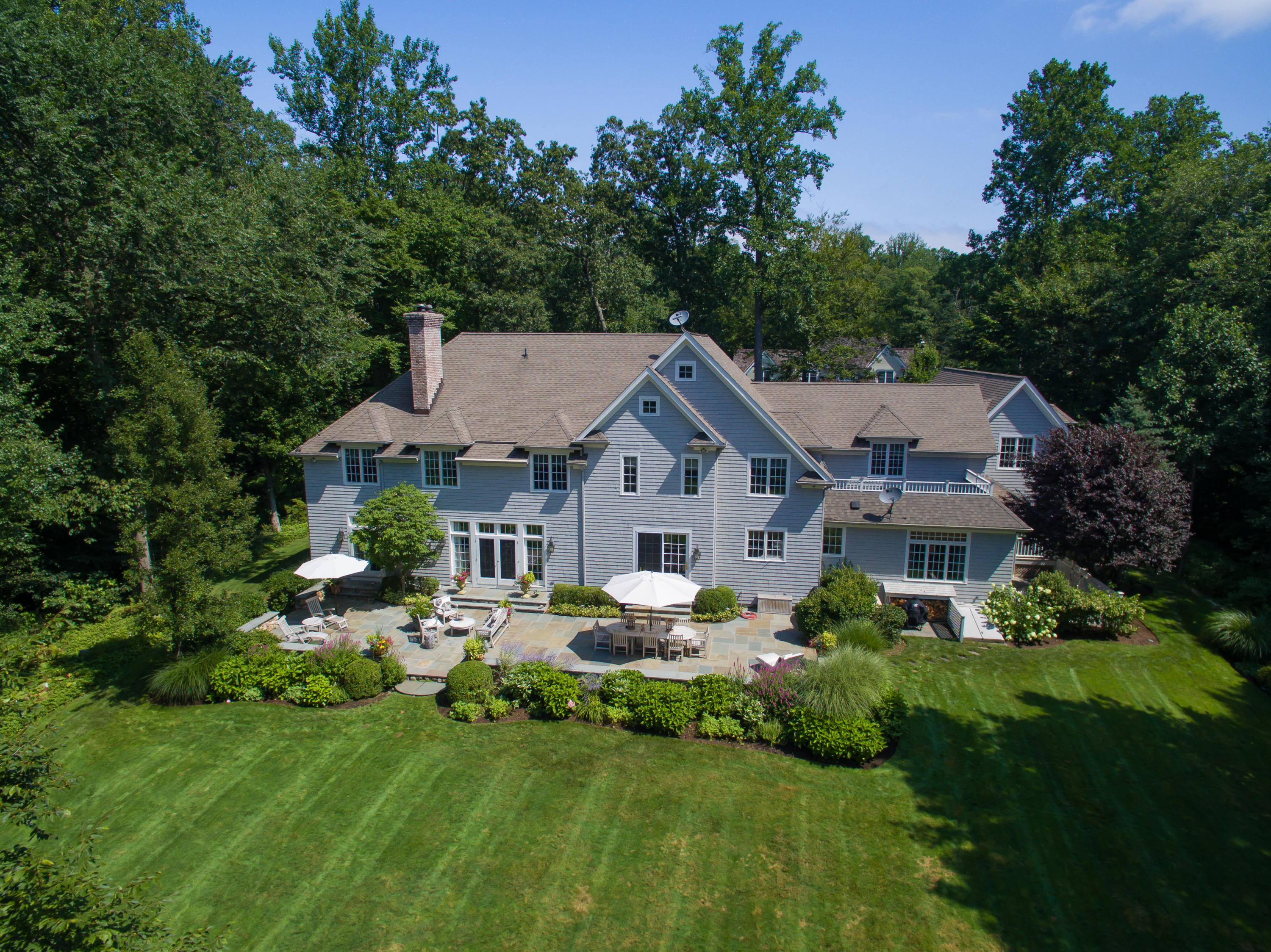 50 Deepwood Road Darien, CT 06820 - Photo 3 of 54 a aerial view of a house with swimming pool and garden
