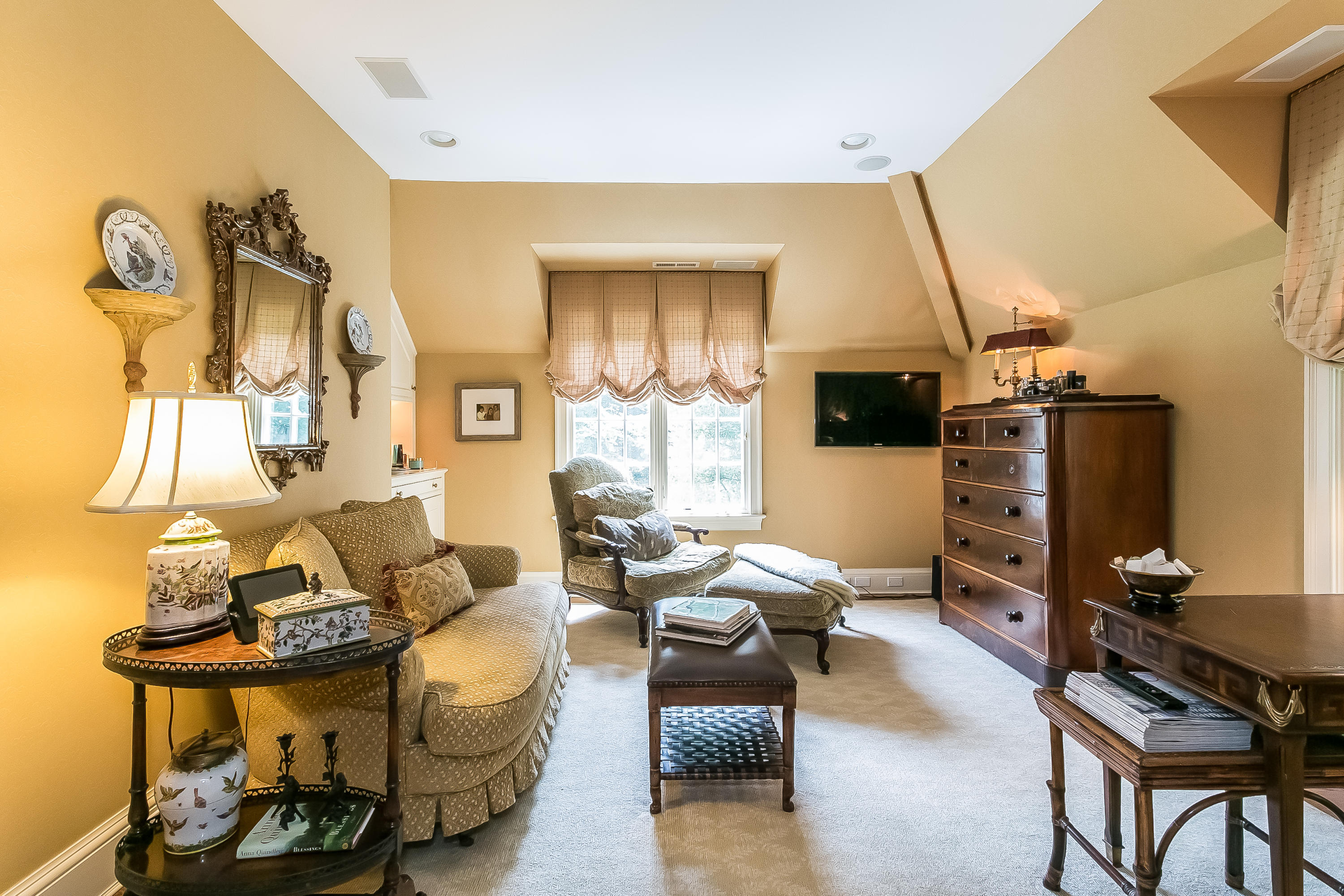 50 Deepwood Road Darien, CT 06820 - Photo 31 of 54 a living room with furniture a flat screen tv and a table